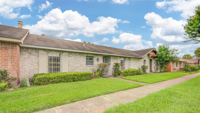 12803 High Star Dr, Houston, TX 77072 - ranch-style house featuring a front lawn and brick siding