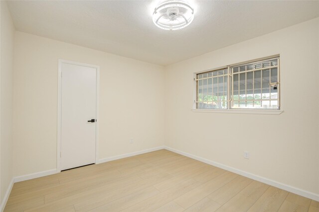 12803 High Star Dr, Houston, TX 77072 - unfurnished room featuring wood finished floors and baseboards
