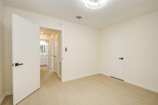 12803 High Star Dr, Houston, TX 77072 - empty room featuring attic access and light wood-type flooring