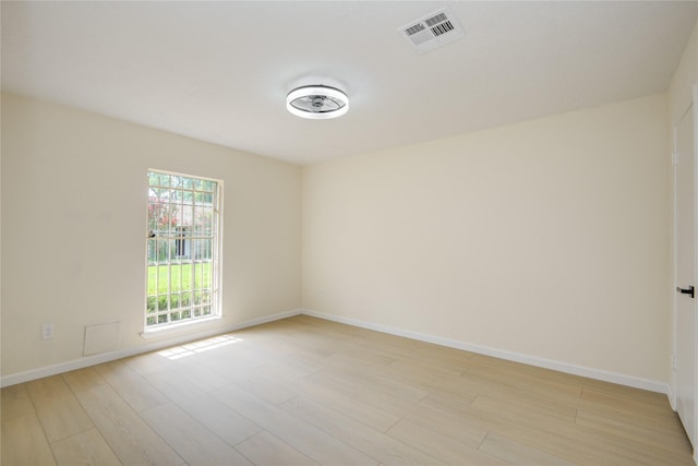 12803 High Star Dr, Houston, TX 77072 - spare room with light wood-type flooring and baseboards