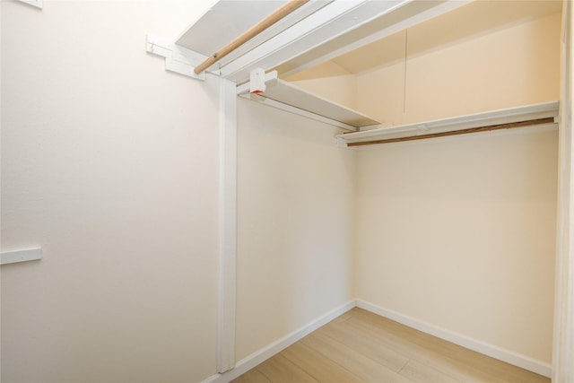 12803 High Star Dr, Houston, TX 77072 - walk in closet with wood finished floors
