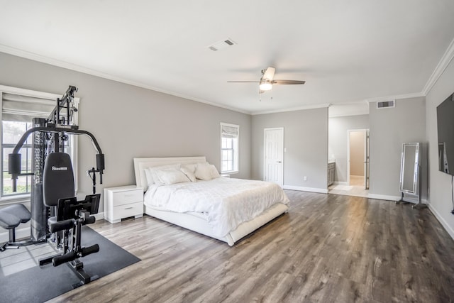 248 Wilcrest Dr Unit 248, Houston, TX 77042 - bedroom with wood finished floors, ornamental molding, ceiling fan, and ensuite bathroom