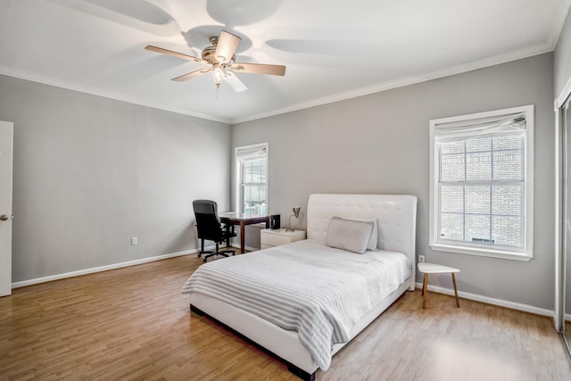 248 Wilcrest Dr Unit 248, Houston, TX 77042 - bedroom featuring wood finished floors, ornamental molding, and ceiling fan