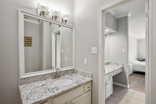 248 Wilcrest Dr Unit 248, Houston, TX 77042 - bathroom with crown molding, vanity, tile patterned flooring, and connected bathroom