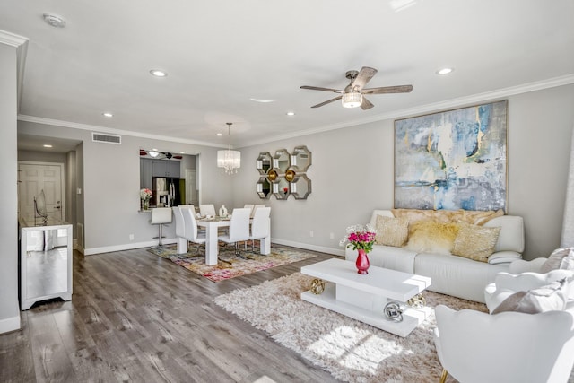 248 Wilcrest Dr Unit 248, Houston, TX 77042 - living area with a ceiling fan, recessed lighting, wood finished floors, crown molding, and a chandelier