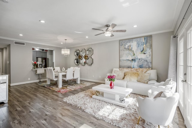 248 Wilcrest Dr Unit 248, Houston, TX 77042 - living room with ceiling fan, crown molding, recessed lighting, wood finished floors, and a chandelier
