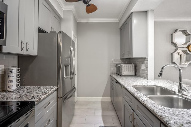 248 Wilcrest Dr Unit 248, Houston, TX 77042 - kitchen featuring gray cabinets, appliances with stainless steel finishes, ornamental molding, backsplash, and light stone counters