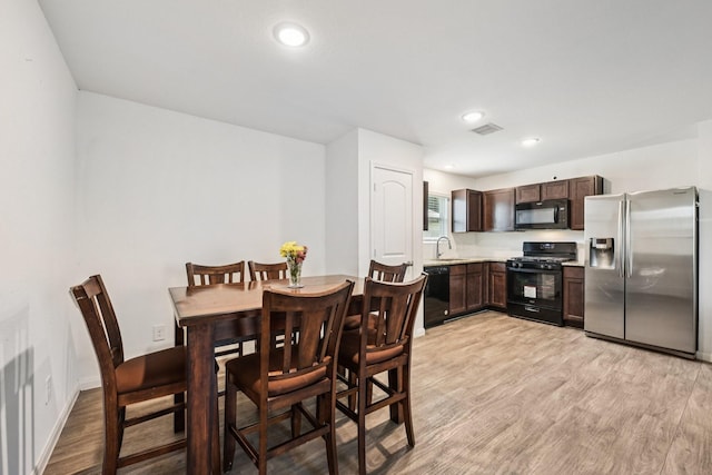 852 Rd 5138, Cleveland, TX 77327 - dining space with light wood-type flooring and recessed lighting