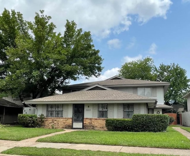 5664 Birchmont Dr Unit 4, Houston, TX 77091 - view of front facade with brick siding and a shingled roof