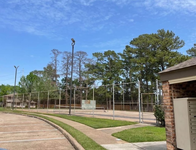 5664 Birchmont Dr Unit 4, Houston, TX 77091 - surrounding community with a tennis court and mail area