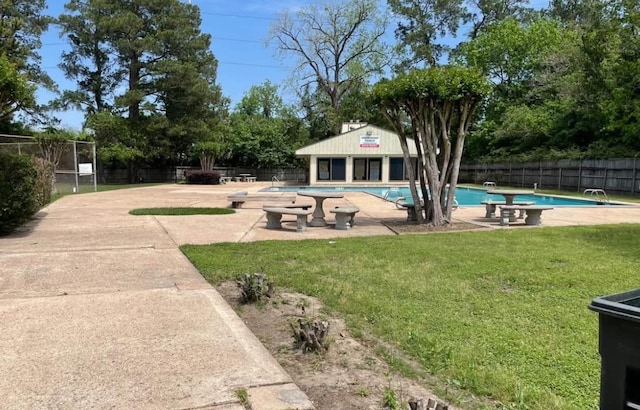 5664 Birchmont Dr Unit 4, Houston, TX 77091 - fenced backyard featuring a community pool and a patio area