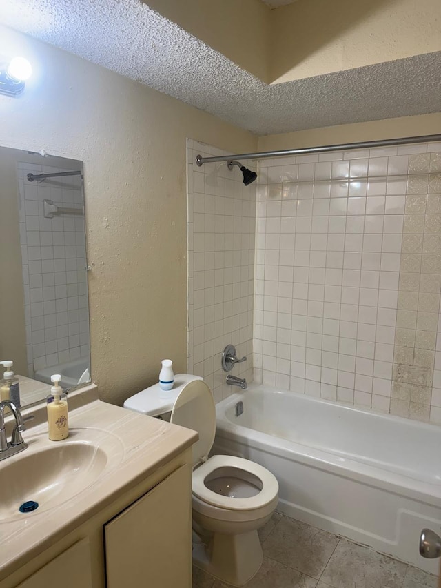 5664 Birchmont Dr Unit 4, Houston, TX 77091 - bathroom featuring a textured wall, a textured ceiling, tile patterned floors, vanity, and bathtub / shower combination