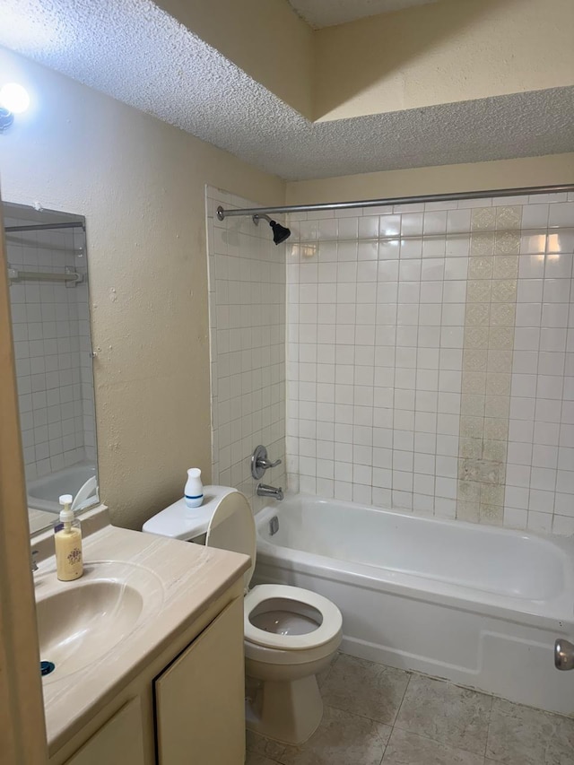 5664 Birchmont Dr Unit 4, Houston, TX 77091 - full bathroom with a textured wall, a textured ceiling, vanity, tile patterned floors, and tub / shower combination