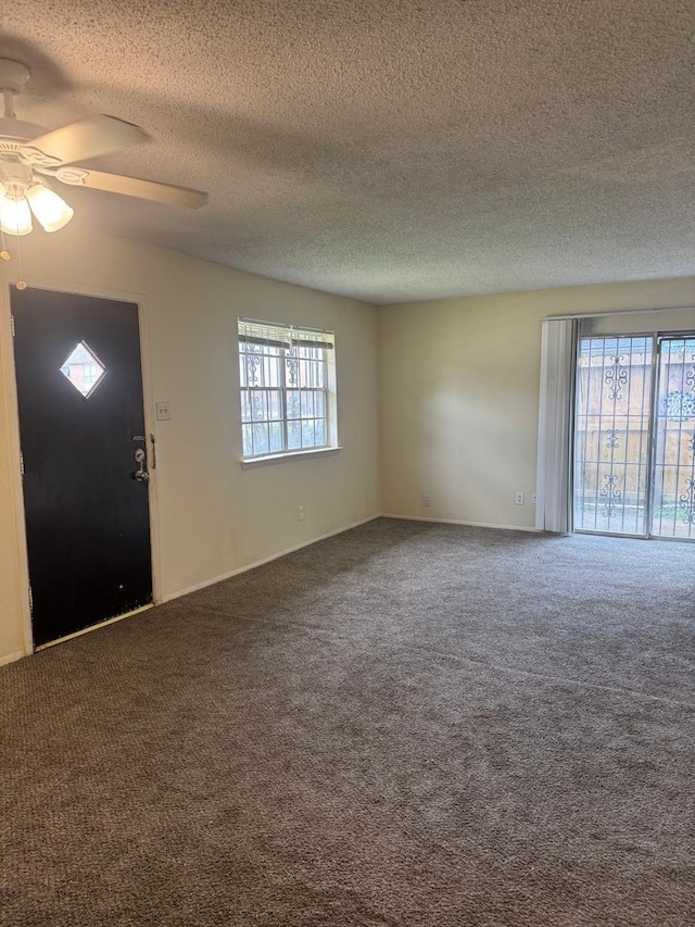 5664 Birchmont Dr Unit 4, Houston, TX 77091 - carpeted spare room with ceiling fan and a textured ceiling