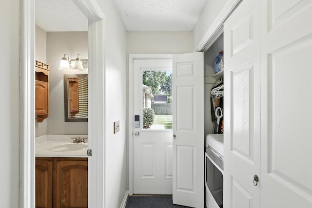 10410 Dude Rd, Houston, TX 77064 - entryway featuring a sink and a textured ceiling