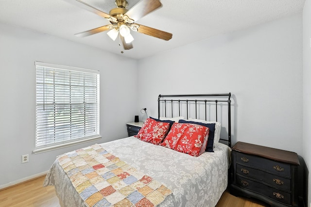10410 Dude Rd, Houston, TX 77064 - bedroom with wood finished floors and ceiling fan