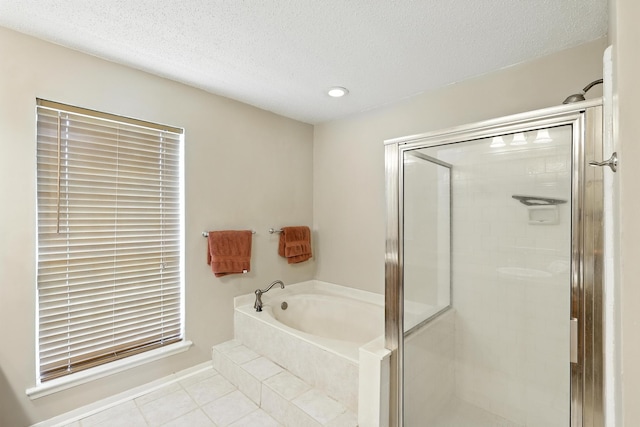 10410 Dude Rd, Houston, TX 77064 - full bath featuring a bath, a stall shower, tile patterned floors, a textured ceiling, and recessed lighting