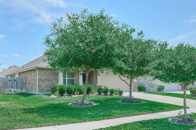 18811 Palmetto Hills Dr, New Caney, TX 77357 - obstructed view of property with brick siding, a garage, and driveway