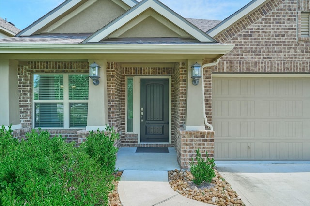 18811 Palmetto Hills Dr, New Caney, TX 77357 - property entrance featuring an attached garage, covered porch, stucco siding, brick siding, and concrete driveway