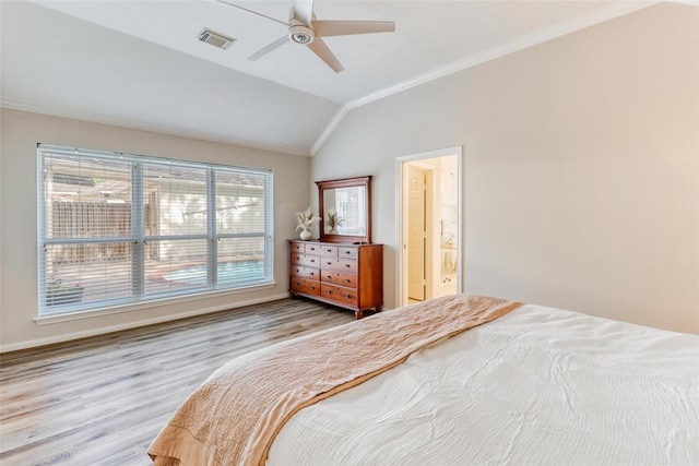 23314 Dunhill Ct, Katy, TX 77494 - bedroom with ornamental molding, vaulted ceiling, wood finished floors, ceiling fan, and connected bathroom