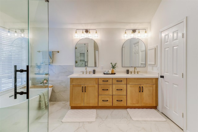 23314 Dunhill Ct, Katy, TX 77494 - bathroom with double vanity, a freestanding bath, marble finish floors, and a shower