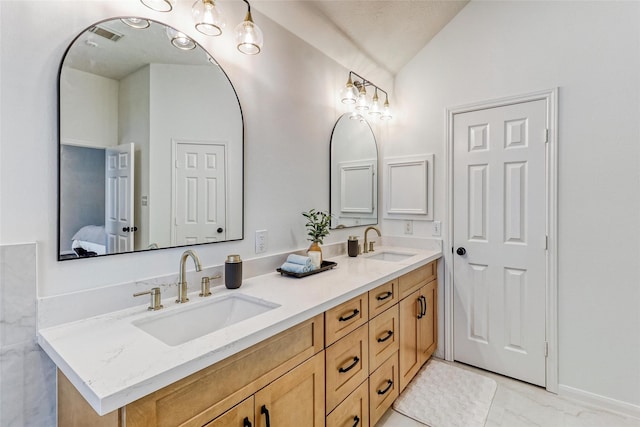 23314 Dunhill Ct, Katy, TX 77494 - bathroom featuring ensuite bathroom, lofted ceiling, and double vanity