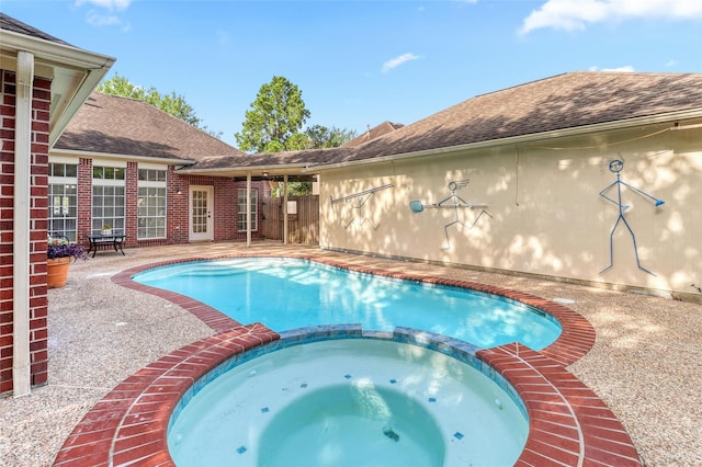 23314 Dunhill Ct, Katy, TX 77494 - view of swimming pool featuring a pool with connected hot tub and a patio