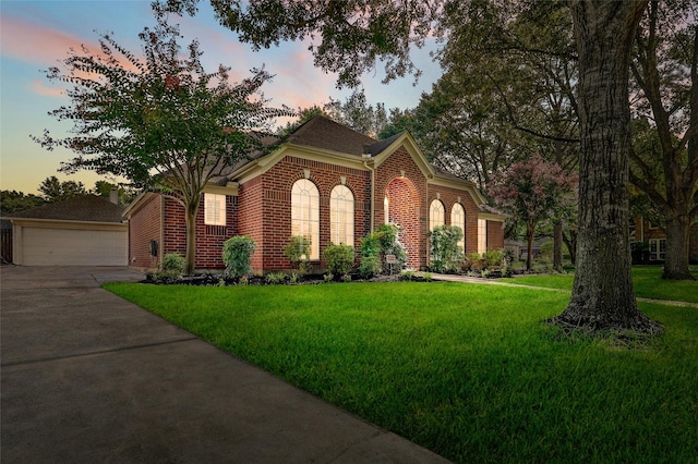 23314 Dunhill Ct, Katy, TX 77494 - view of front of property featuring brick siding, a yard, and a garage