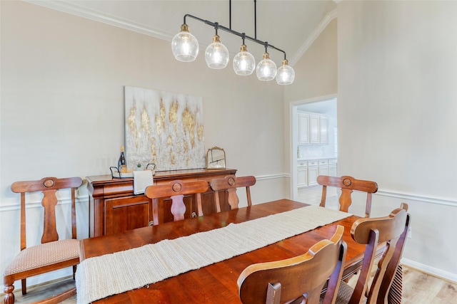 23314 Dunhill Ct, Katy, TX 77494 - dining space featuring ornamental molding, light wood-style floors, and high vaulted ceiling