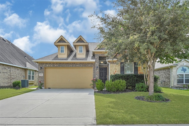 15023 Winter Valley Ct, Humble, TX 77396 - view of front facade with concrete driveway, a front yard, brick siding, an attached garage, and a shingled roof