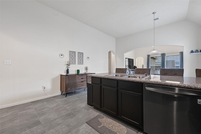 15023 Winter Valley Ct, Humble, TX 77396 - kitchen featuring dishwasher, arched walkways, lofted ceiling, hanging light fixtures, and dark stone counters