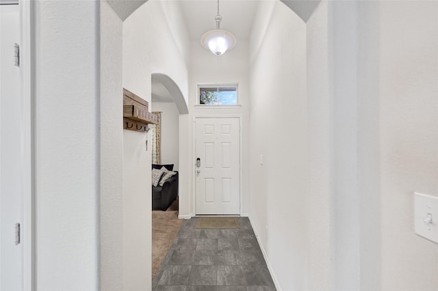 15023 Winter Valley Ct, Humble, TX 77396 - doorway to outside featuring arched walkways and a high ceiling
