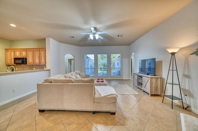 519 Ivory Stone Ln, League City, TX 77573 - living area featuring ceiling fan, arched walkways, light tile patterned floors, and recessed lighting