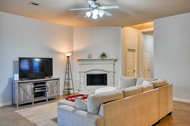 519 Ivory Stone Ln, League City, TX 77573 - living room featuring ceiling fan, a fireplace with raised hearth, and tile patterned floors