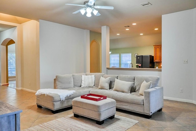 519 Ivory Stone Ln, League City, TX 77573 - living room featuring arched walkways, light tile patterned floors, ceiling fan, and recessed lighting
