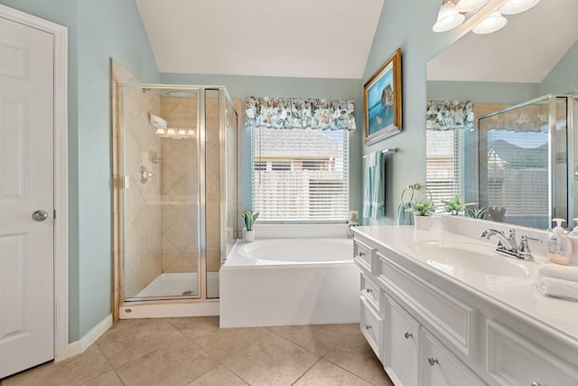 519 Ivory Stone Ln, League City, TX 77573 - bathroom with vaulted ceiling, vanity, tile patterned floors, a garden tub, and a stall shower
