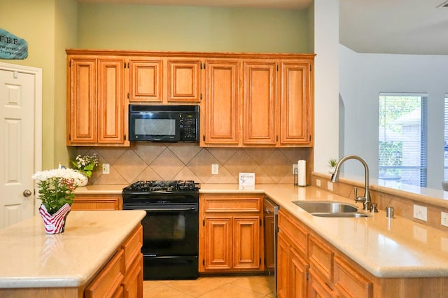 519 Ivory Stone Ln, League City, TX 77573 - kitchen with black appliances, decorative backsplash, light tile patterned floors, a peninsula, and light stone counters