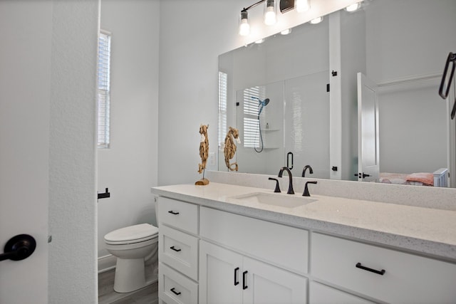 1229 N Stingaree Dr, Crystal Beach, TX 77650 - full bath with vanity, a shower with door, and wood finished floors