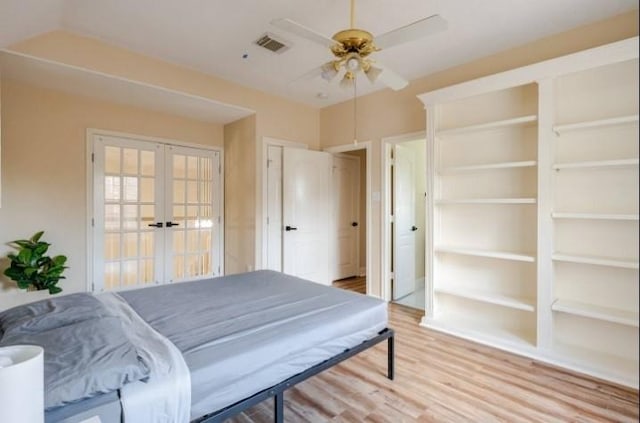 20522 Riverside Pines Dr, Houston, TX 77346 - bedroom with french doors, light wood finished floors, and a ceiling fan