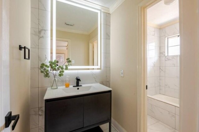 20522 Riverside Pines Dr, Houston, TX 77346 - bathroom featuring crown molding, vanity, tile walls, a bath, and a shower