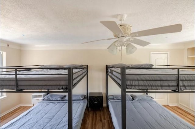 20522 Riverside Pines Dr, Houston, TX 77346 - bedroom with a textured ceiling, wood finished floors, and ornamental molding