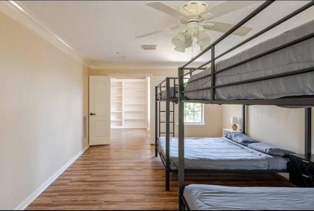 20522 Riverside Pines Dr, Houston, TX 77346 - bedroom featuring wood finished floors and crown molding