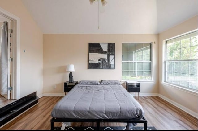 20522 Riverside Pines Dr, Houston, TX 77346 - bedroom featuring lofted ceiling and wood finished floors