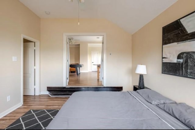20522 Riverside Pines Dr, Houston, TX 77346 - bedroom featuring wood finished floors and lofted ceiling