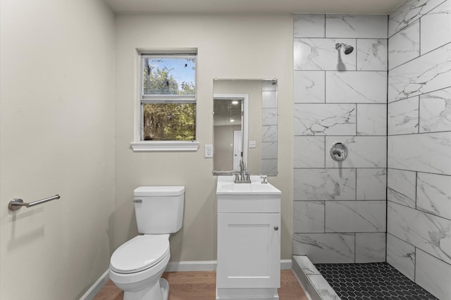 3626 Sparrow St, Houston, TX 77051 - full bath featuring tiled shower, vanity, and wood finished floors