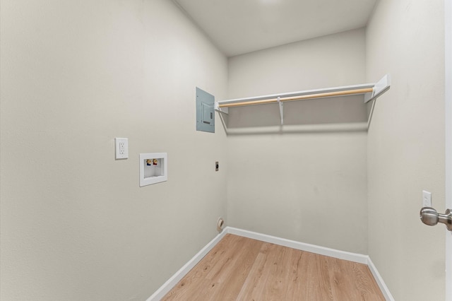 3626 Sparrow St, Houston, TX 77051 - laundry room featuring hookup for an electric dryer, wood finished floors, hookup for a washing machine, and electric panel