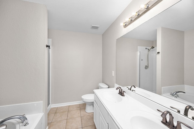 21002 Pineda Cir, Richmond, TX 77406 - bathroom with a garden tub, double vanity, a stall shower, and tile patterned floors