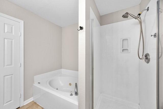 21002 Pineda Cir, Richmond, TX 77406 - bathroom with a stall shower, a whirlpool tub, and tile patterned floors