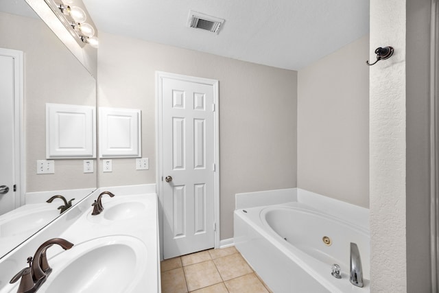 21002 Pineda Cir, Richmond, TX 77406 - bathroom with tile patterned floors, a whirlpool tub, and double vanity