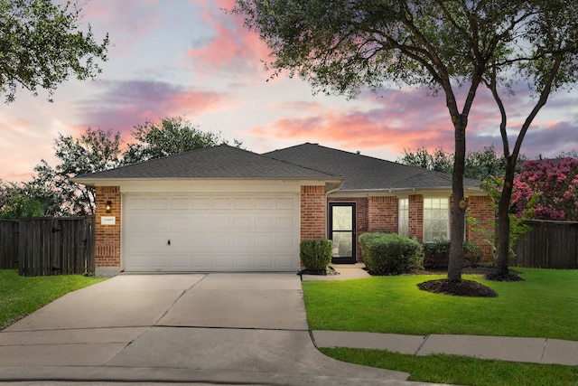 21002 Pineda Cir, Richmond, TX 77406 - ranch-style home featuring brick siding, concrete driveway, an attached garage, and a shingled roof